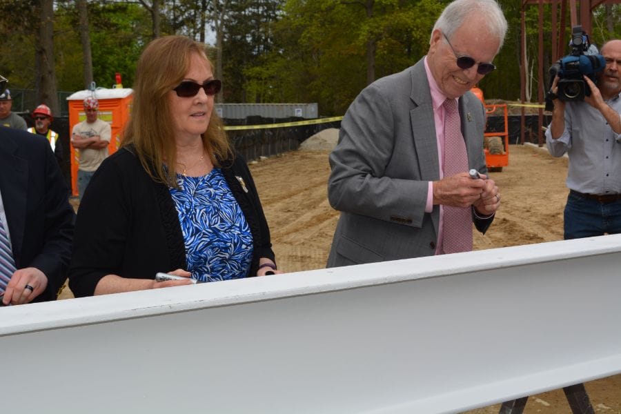 Maureen and Dan Murphy were the first to sign the structure's last beam before it was placed on Tuesday.