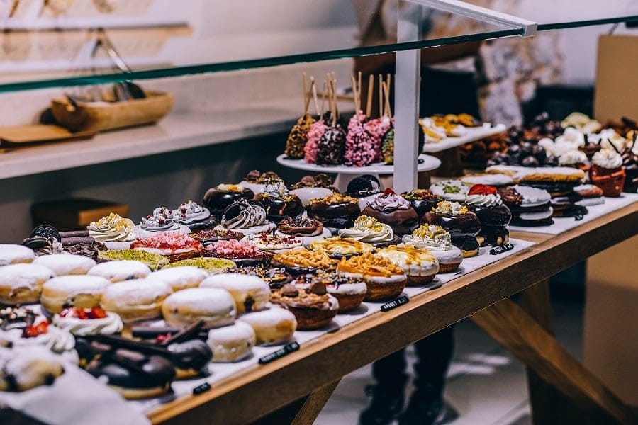 bakery counter with doughnuts and pastries