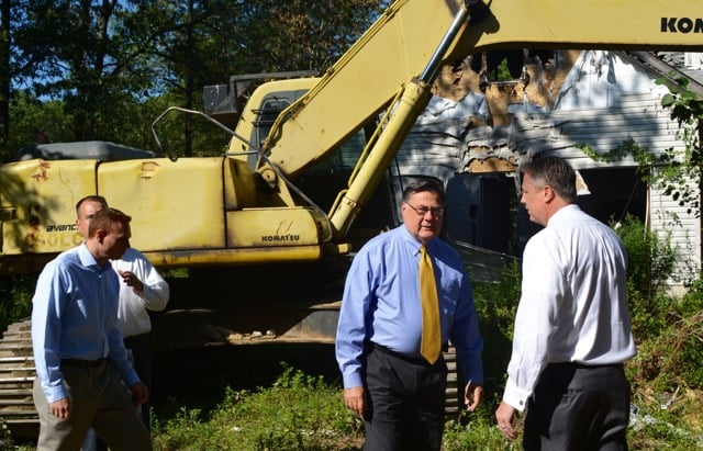 Town Supervisor Ed Romaine (center) and Councilman Neil Foley (right) were joined by other town officials in East Patchogue Wednesday. (Credit: Michael White)