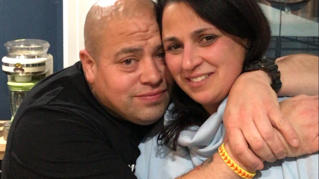 man and woman hugging