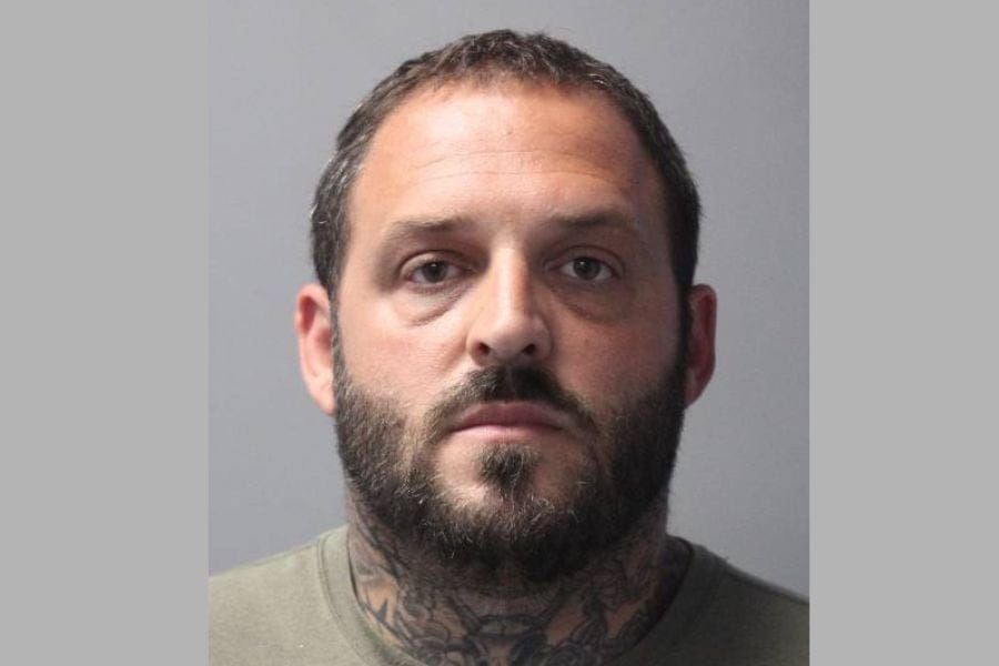 Suffolk County Police arrested a Commack contractor accused of faking a robbery and scamming a family out of