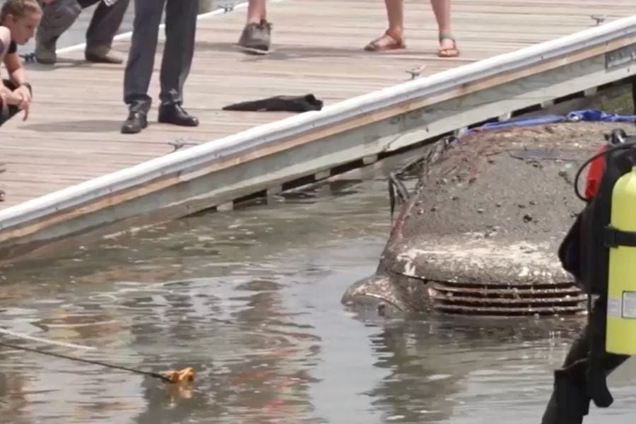 Veteran 1010 WINS reporter Sophia Hall captured this footage of the muck-covered PT Cruiser being pulled from the water off Cedar Beach.