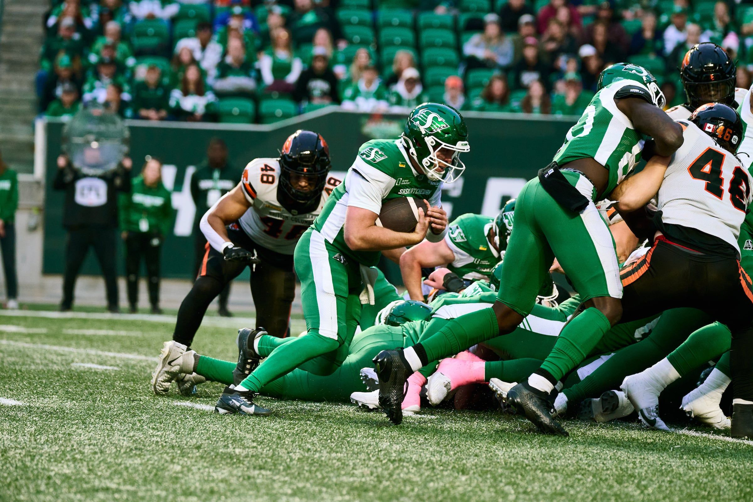 Jack Coan scoring a touchdown for the Roughriders in the CFL (Credit: Arthur Ward)