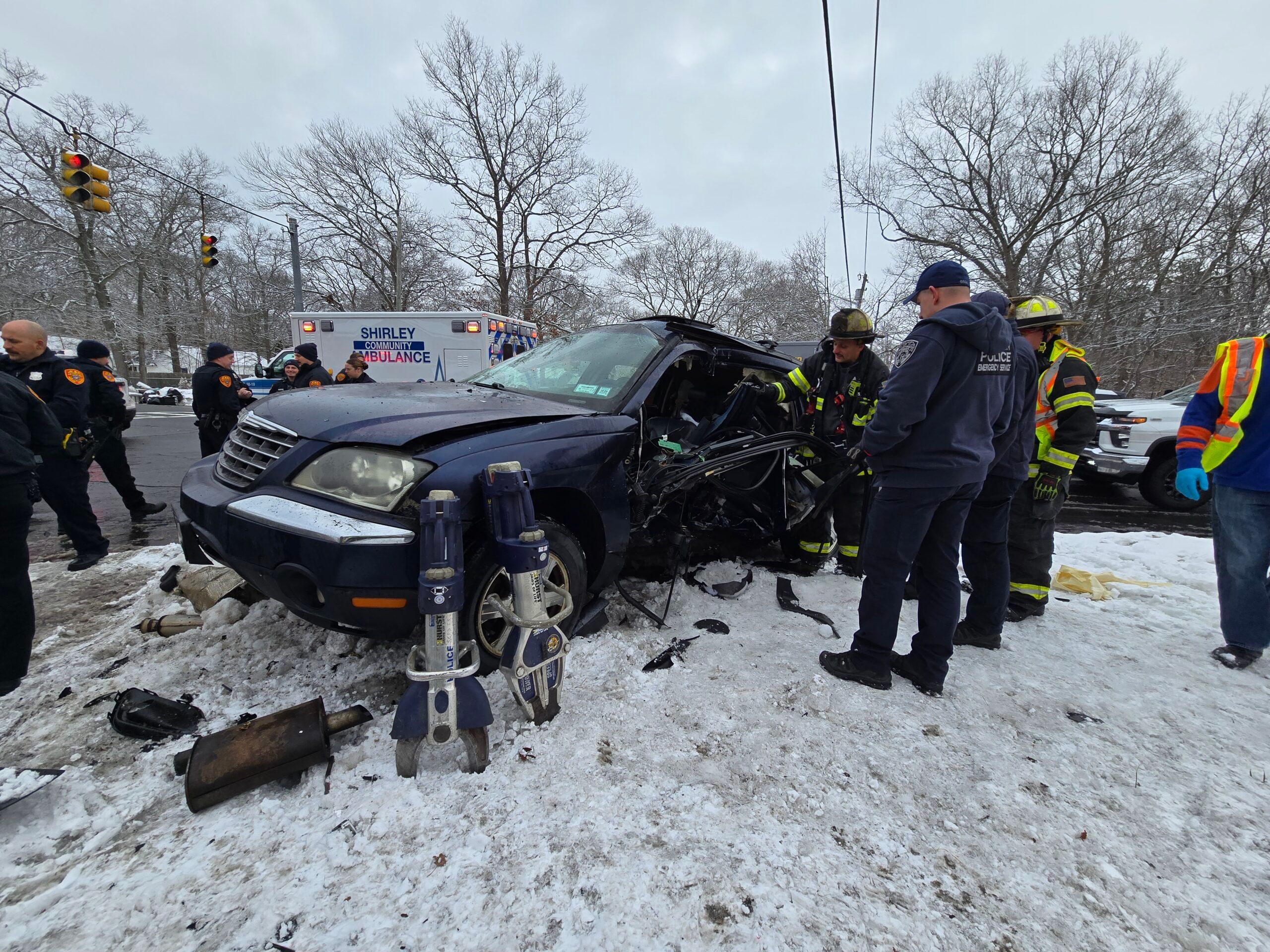 Emergency responders rescued a Shirley woman who was pinned inside her car after a car wreck in Shirley on Monday.