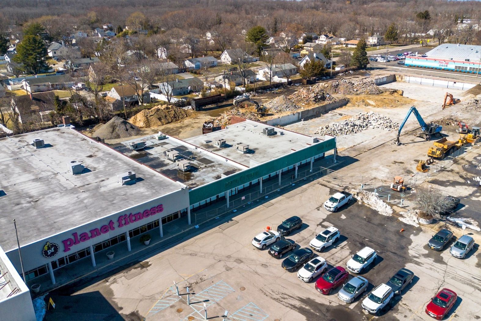 Demolition equipment tears into Jefferson Plaza in Port Jefferson Station as redevelopment begins on the 10.4-acre site.