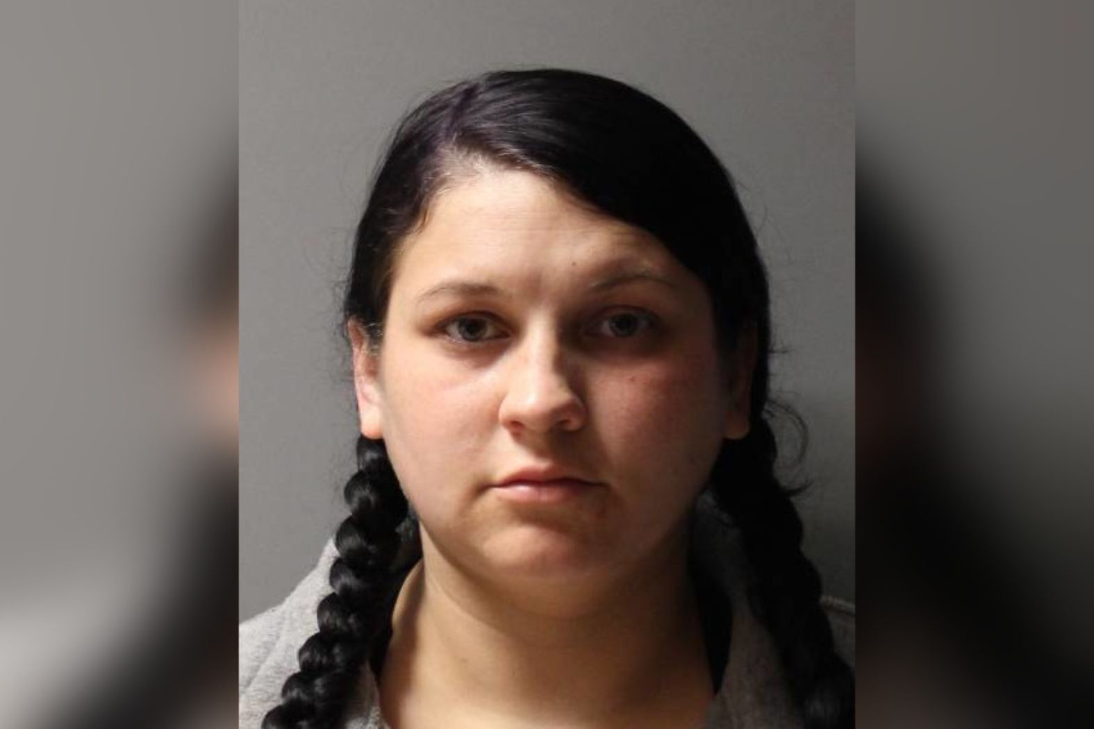 Suffolk County District Attorney Raymond Tierney announces guilty plea of former county employee Brianna Hassett, her hair wrapped in braids in this photo, in bribery scheme.