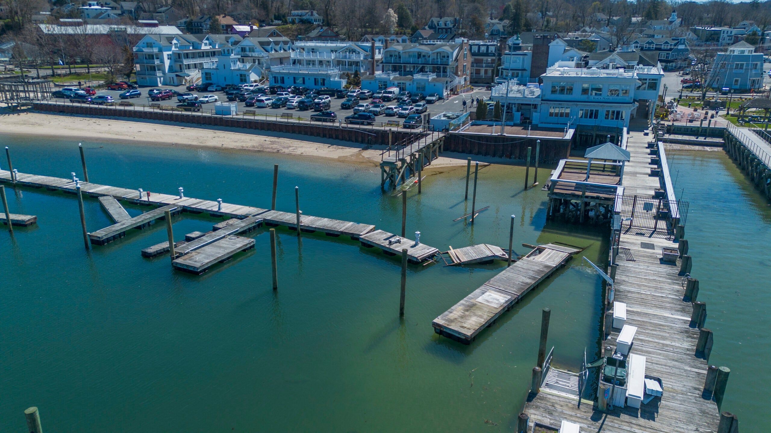 A wide shot of the empty docks and waterfront at Danfords Marina in Port Jefferson Harbor during its 2026 reconstruction project.