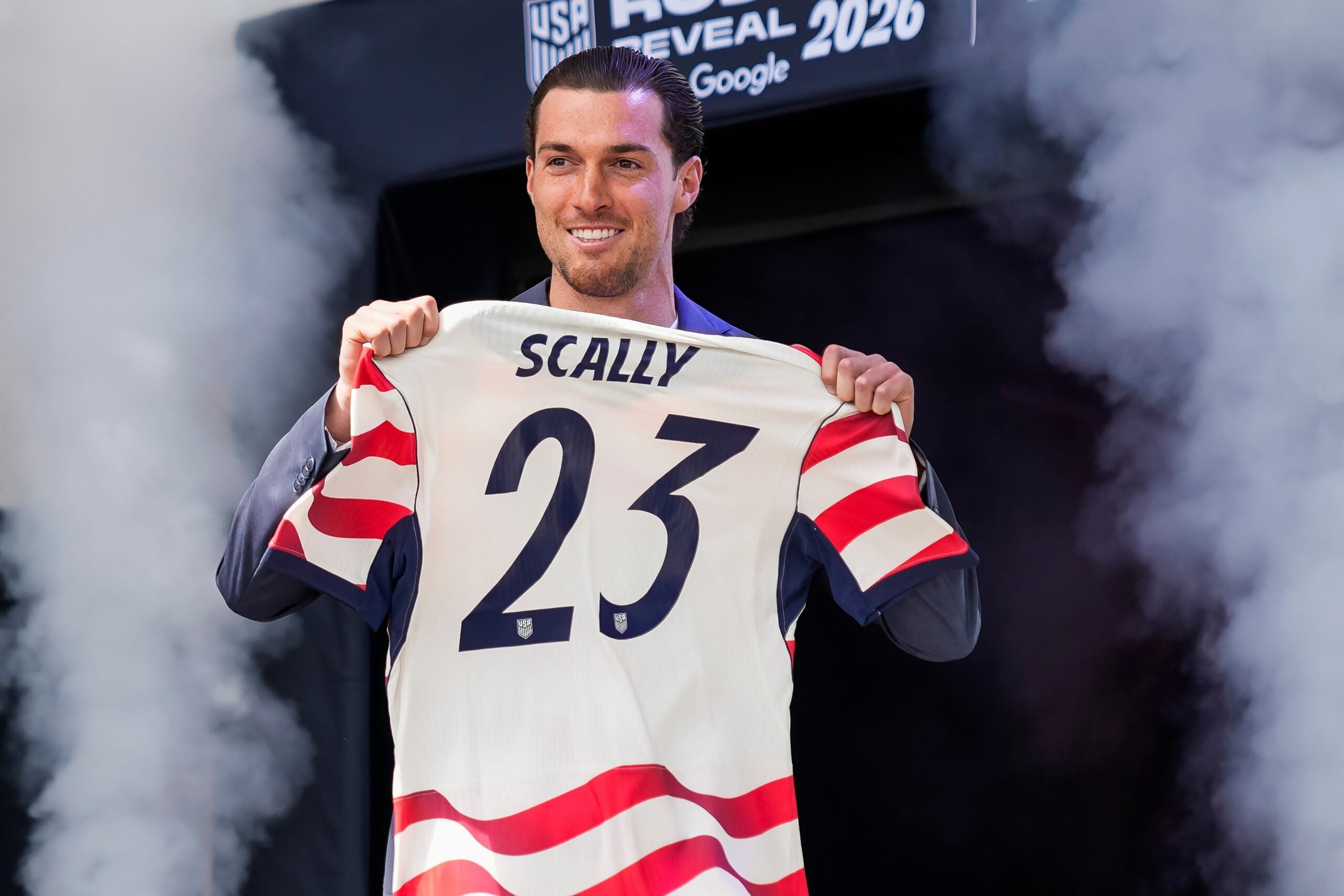 Joe Scally holds up his No. 23 jersey that he'll wear while competing for the U.S. team in the World Cup this summer.