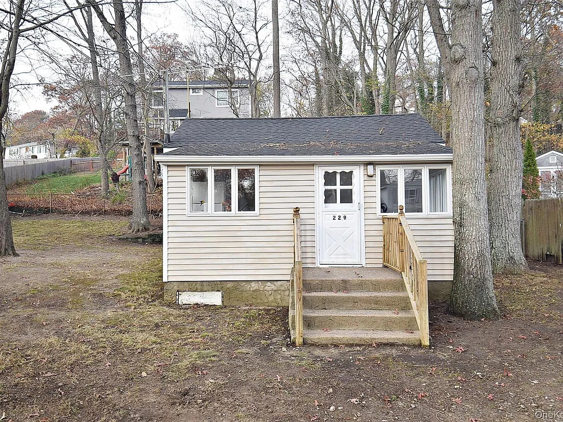 Tiny cottage in Rocky Point hits the market for $399,000. Features over-sized yard.
