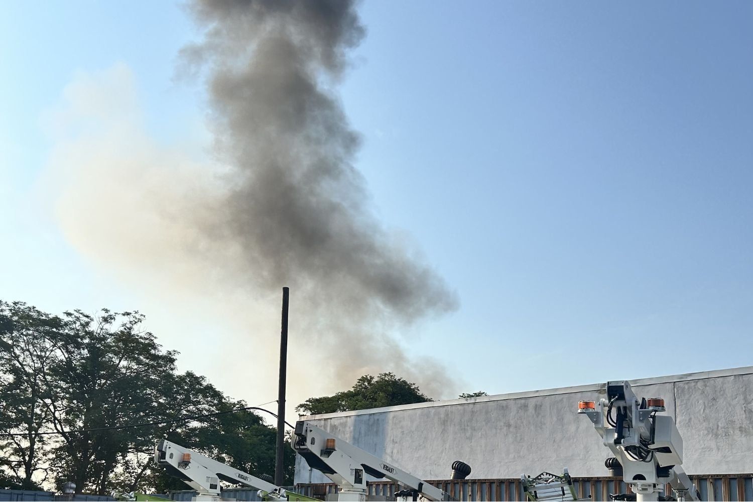 Smoke billowing above building in Holbrook.