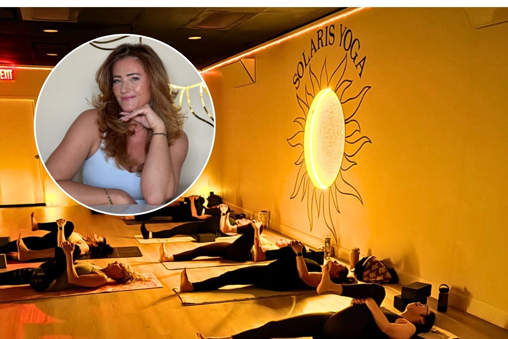 Women practicing yoga in a dimly lit studio space in Shoreham, New York.