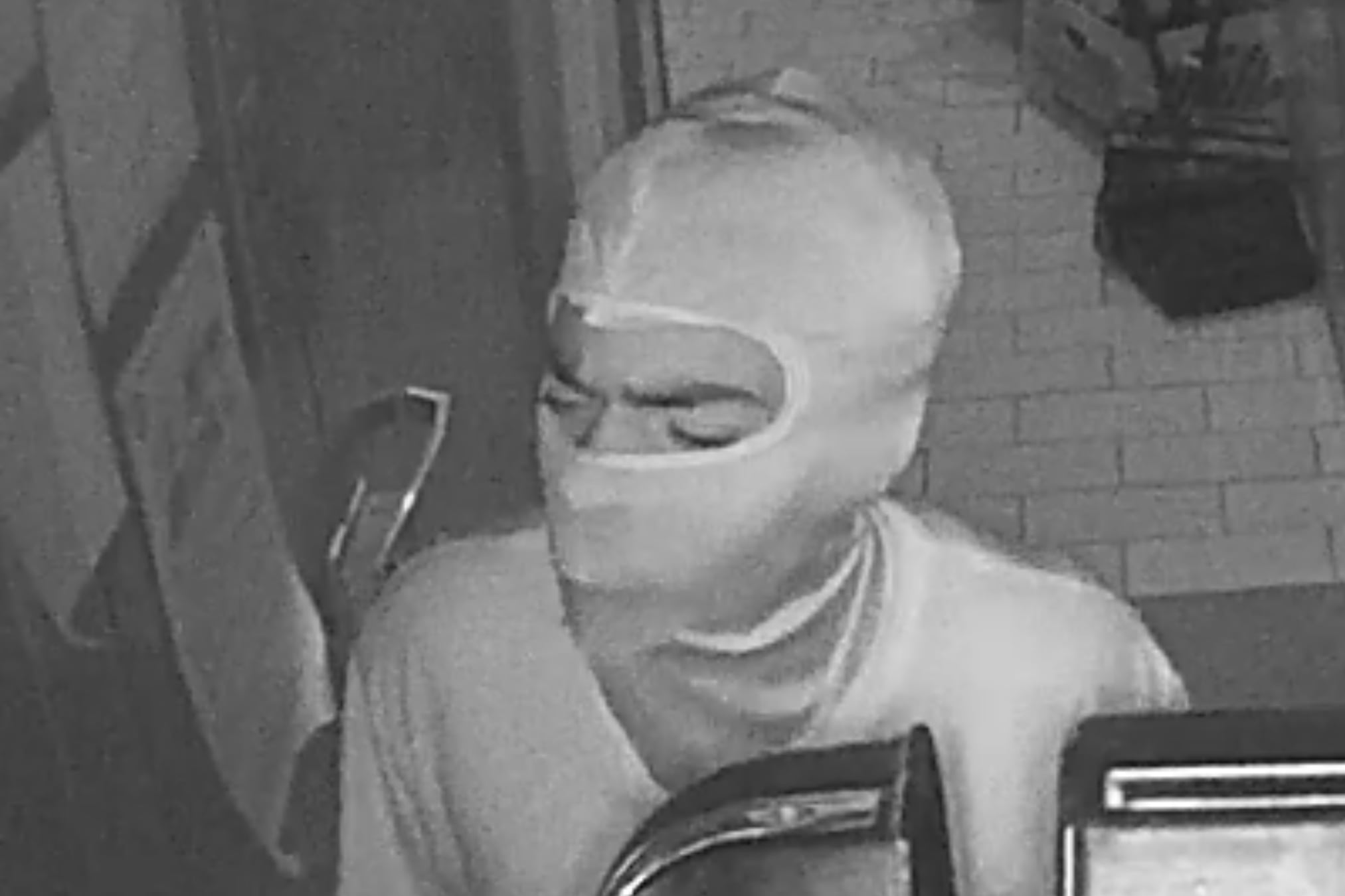 Surveillance image of burglary suspect wanted in break-in at All American Hamburger Drive-In in Massapequa