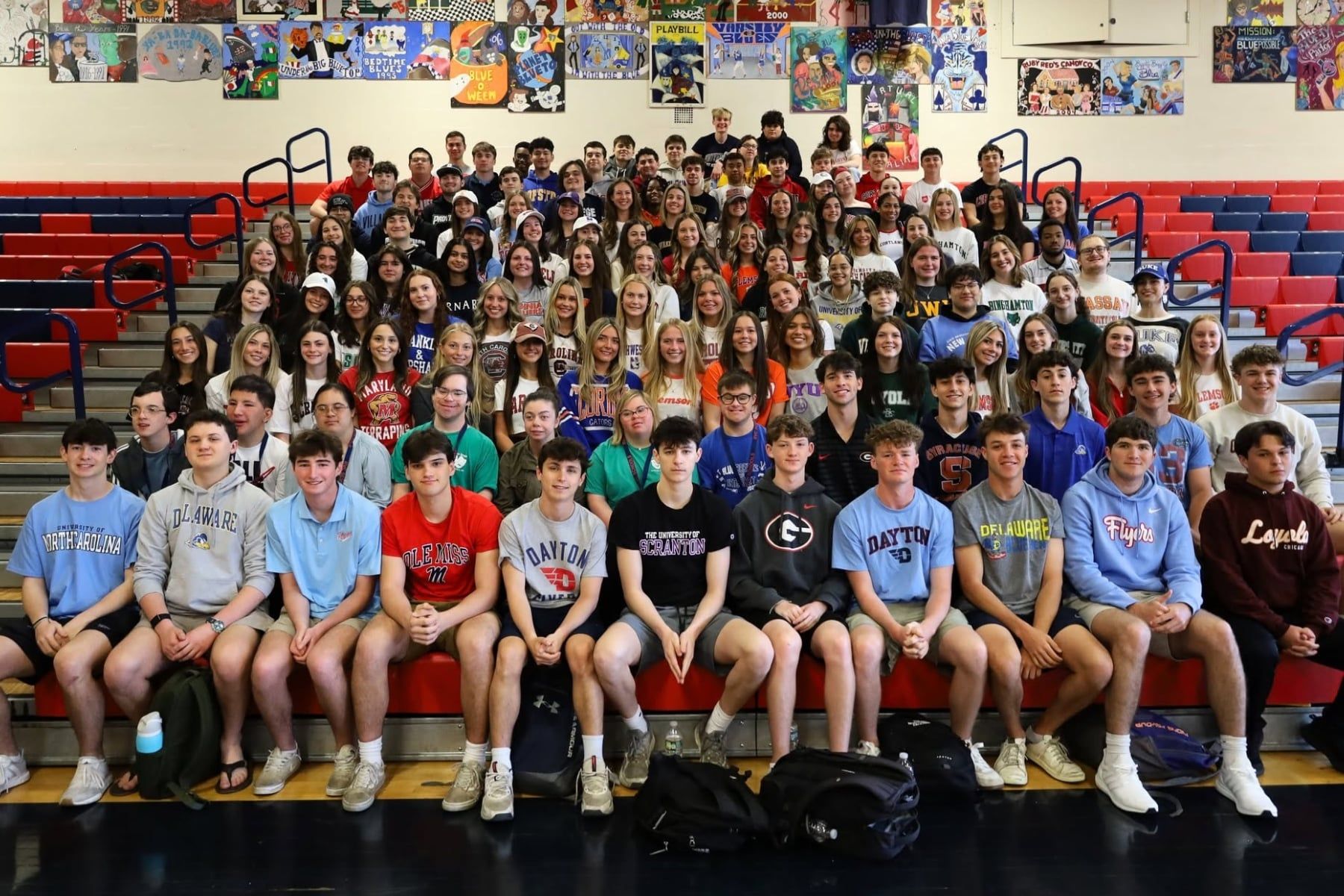 South Side High School's Class of 2025 wearing shirts showing where they're attending college.
