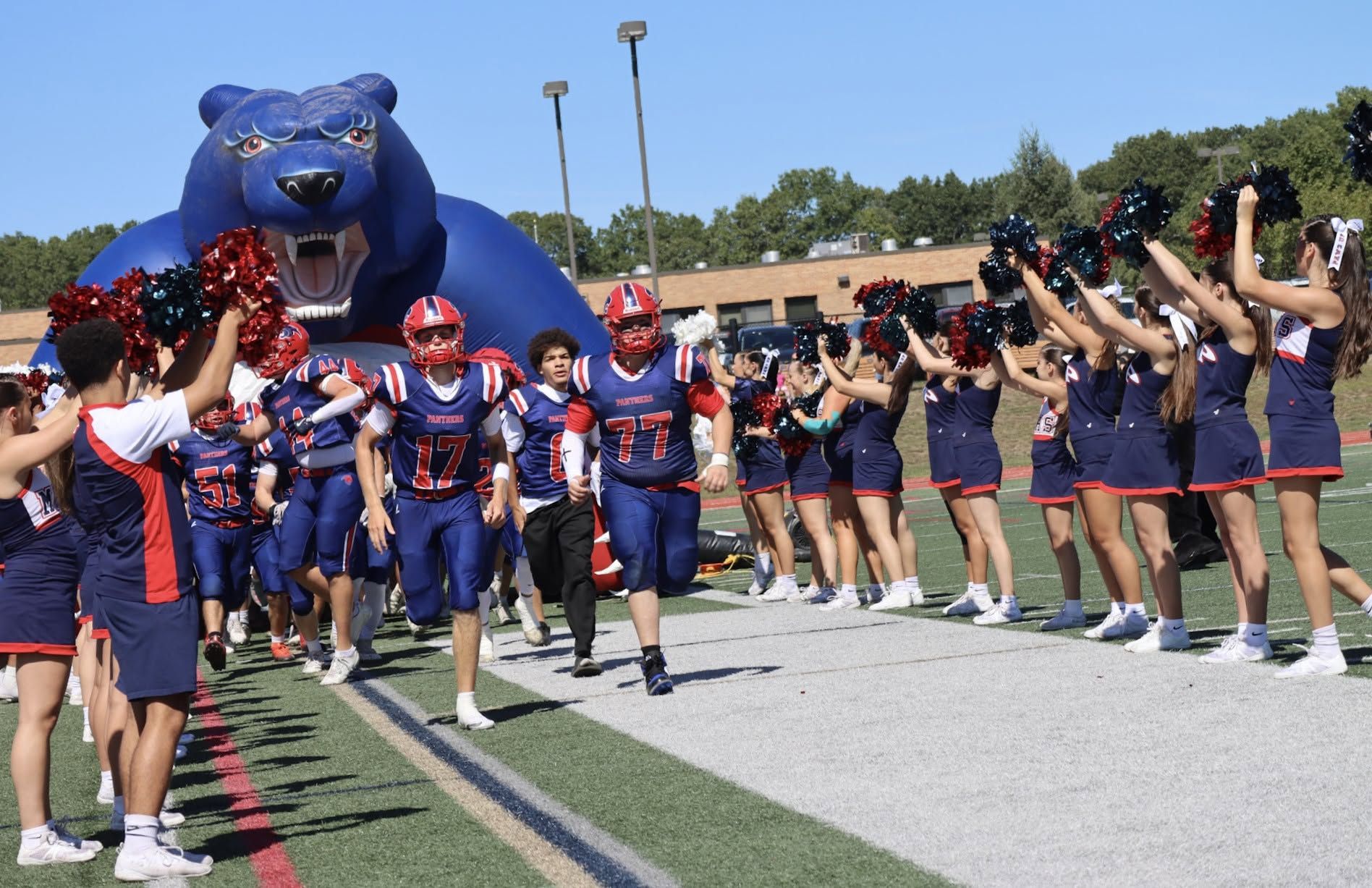 Miller Place players enter the field for a game in 2025.