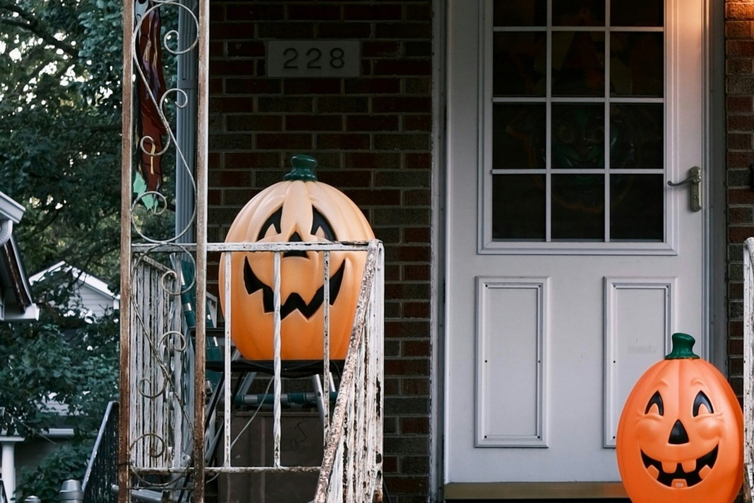 Front porch with plastic jack-o-lanterns for Halloween.