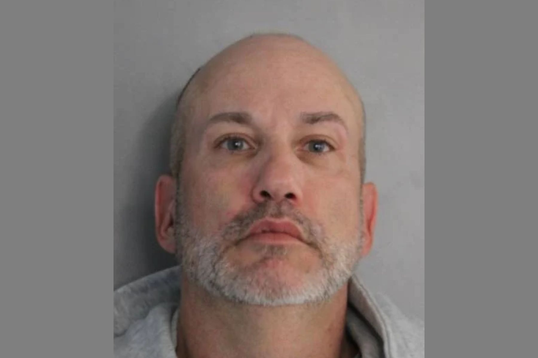 booking photo of man arrested for promoting prostitution.