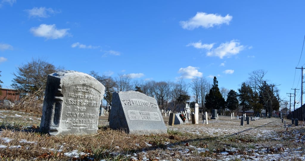 Tombstones that face Waverly Avenue as they appeared Tuesday. (Michael White)