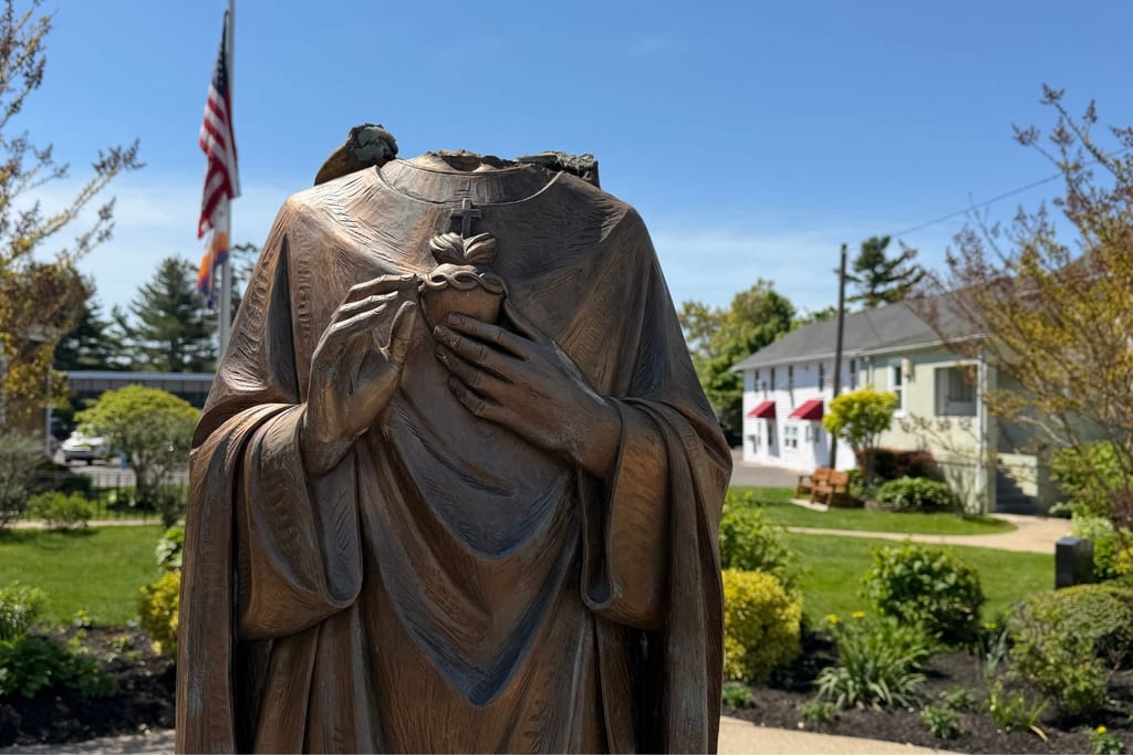 Beheaded statue of Virgin mary statue.