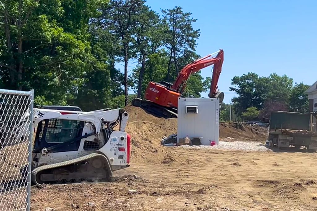 McDonald's site, construction vehicles in action.