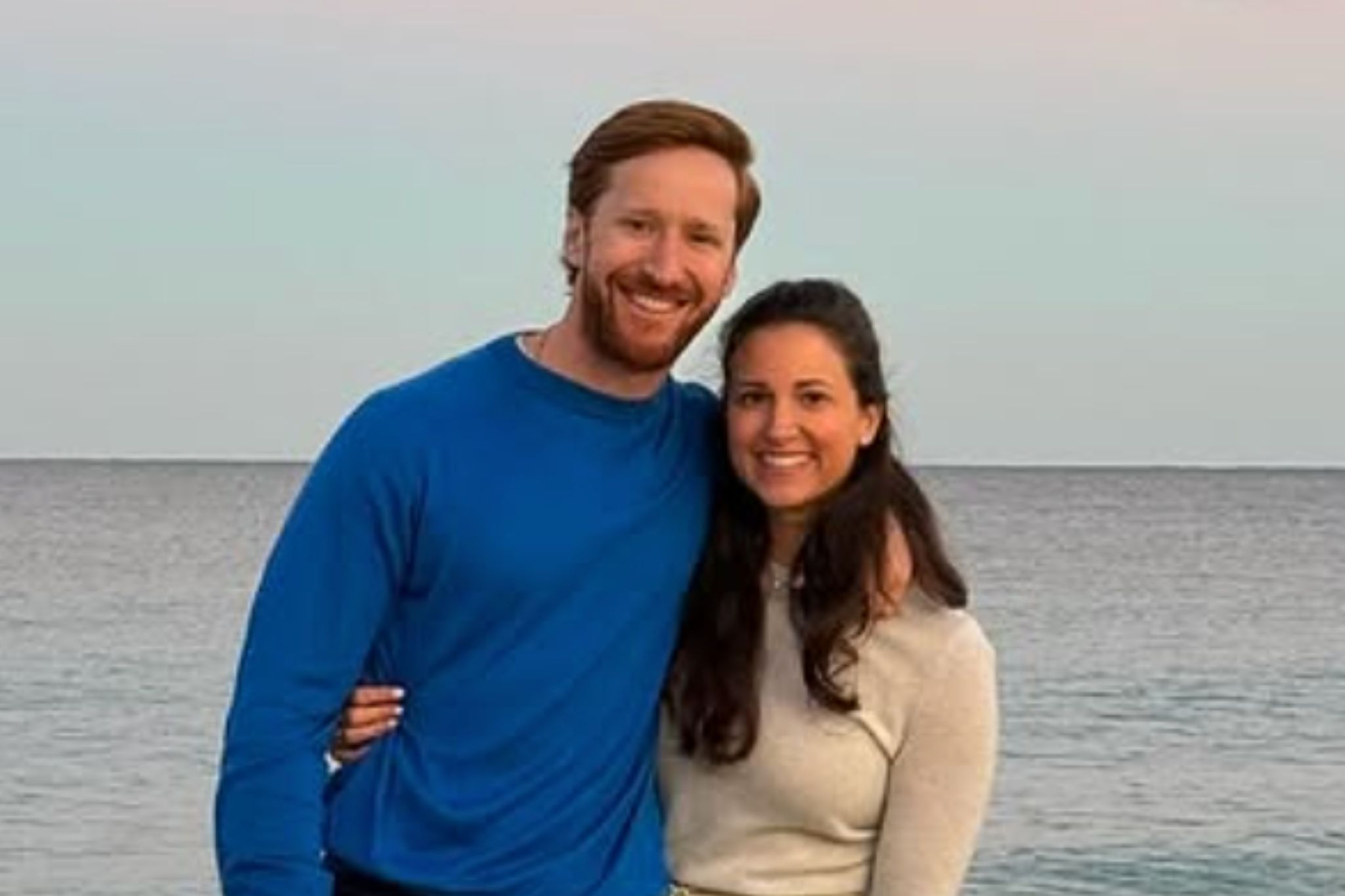 Spencer Korwin with his wife, Carly, on the beach.