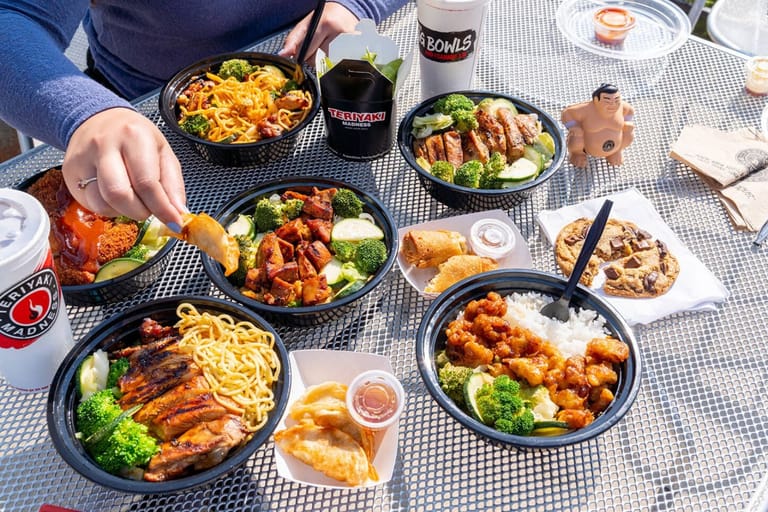 Teriyaki Madness food spread at a restaurant location.