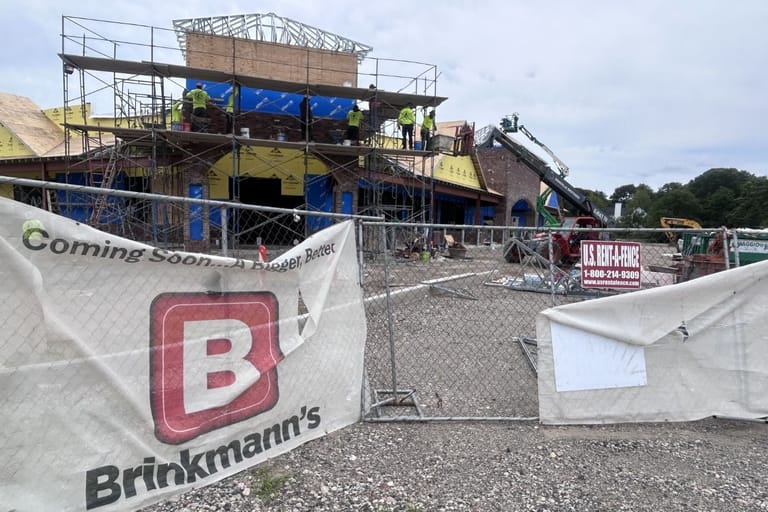 Construction workers building the future Miller Place Brinkmann's True Value location.