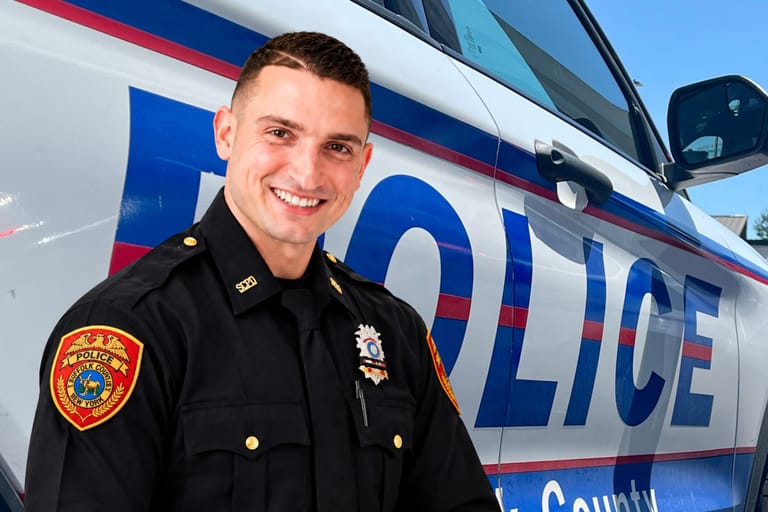 Officer Christopher Durham and a police car.