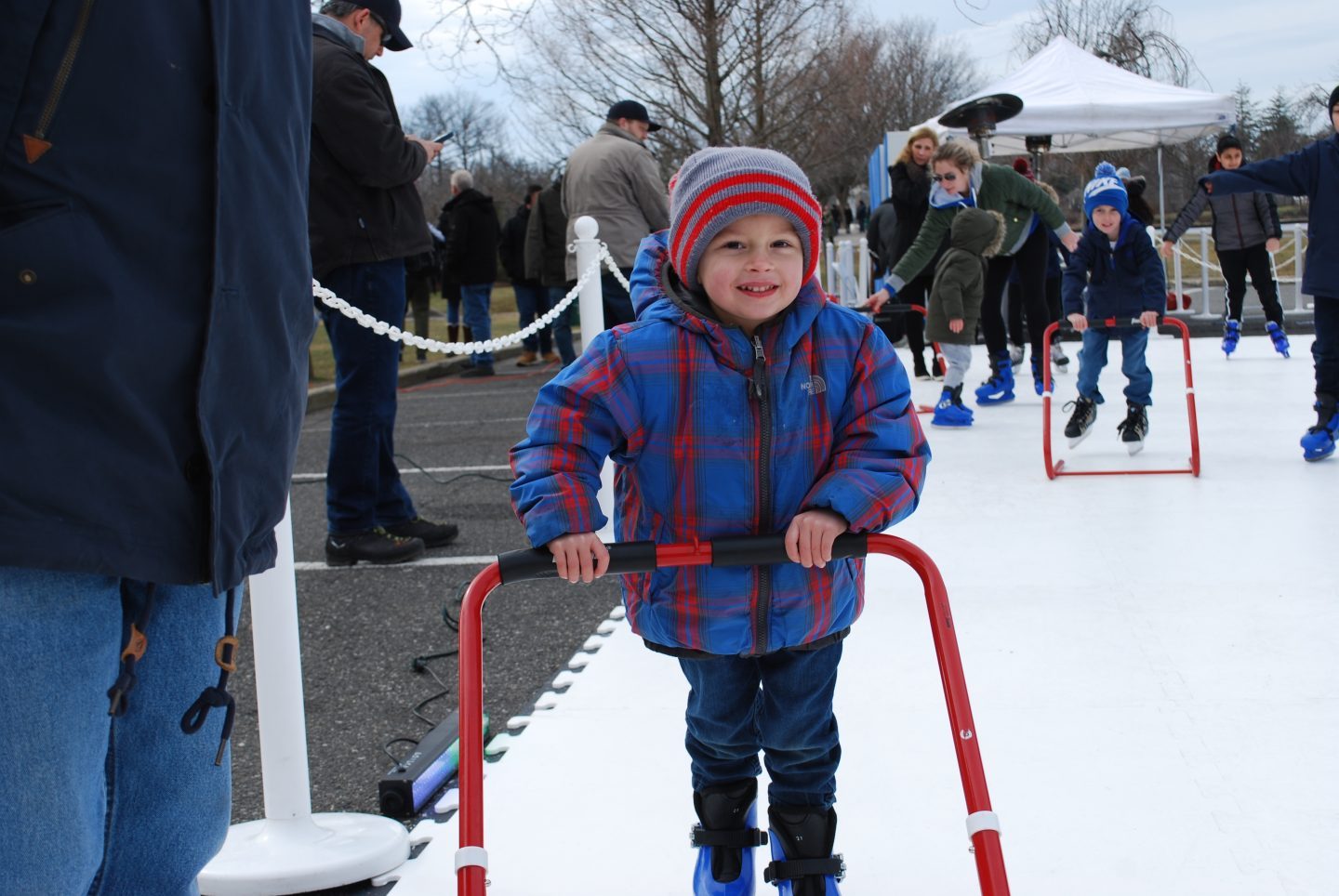 Boy ice skating at Babylon Village's Winterfest