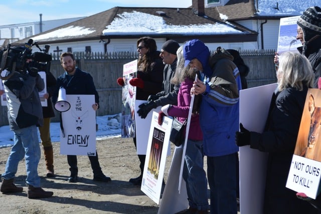 John DiLeonardo, president of Long Island Orchestrating for Nature, leads protestors in Patchogue Friday. (Michael White)