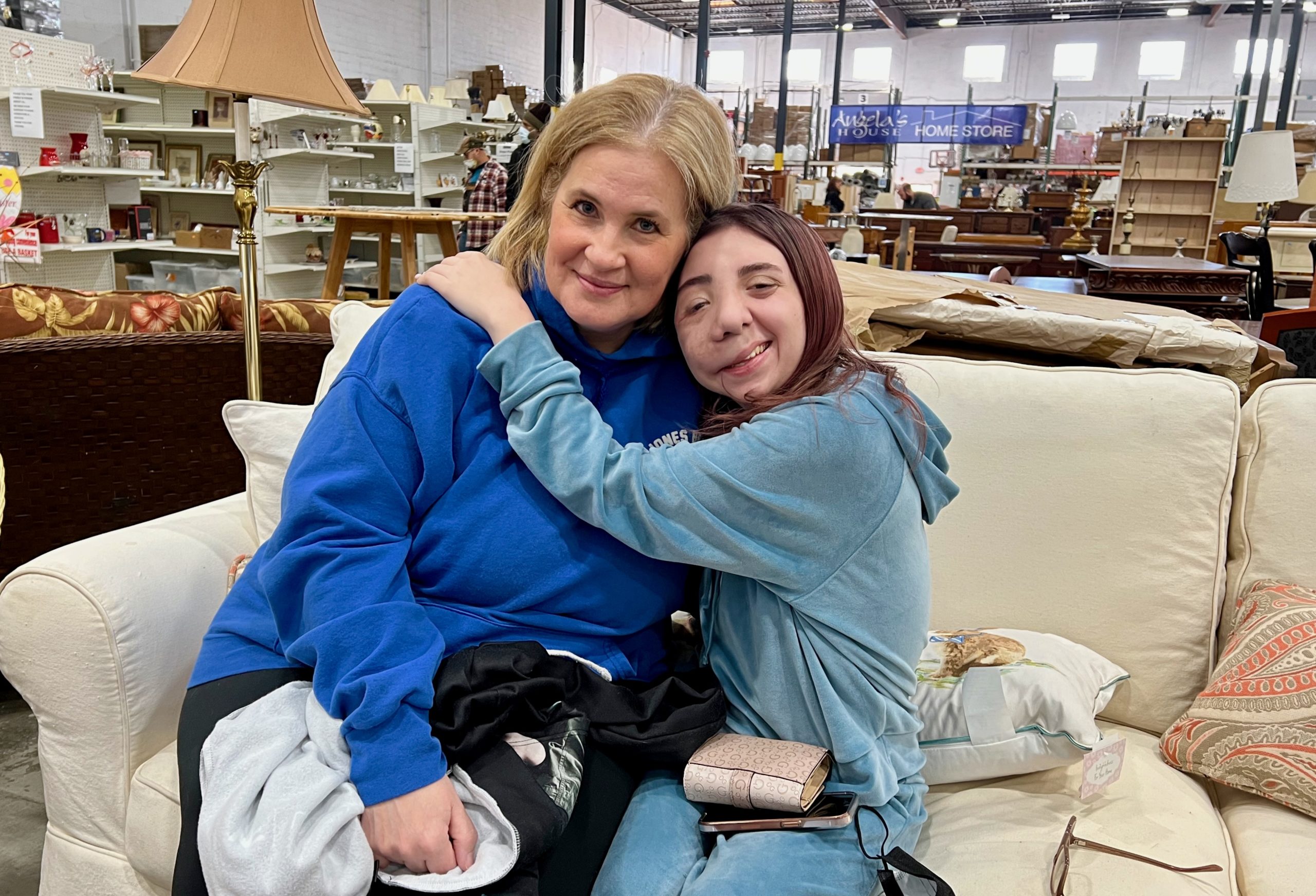 Jessica Lindberg, a nurse case manager, with Gina DiMartino at Angela's House Home Store in Medford. (Michael White)
