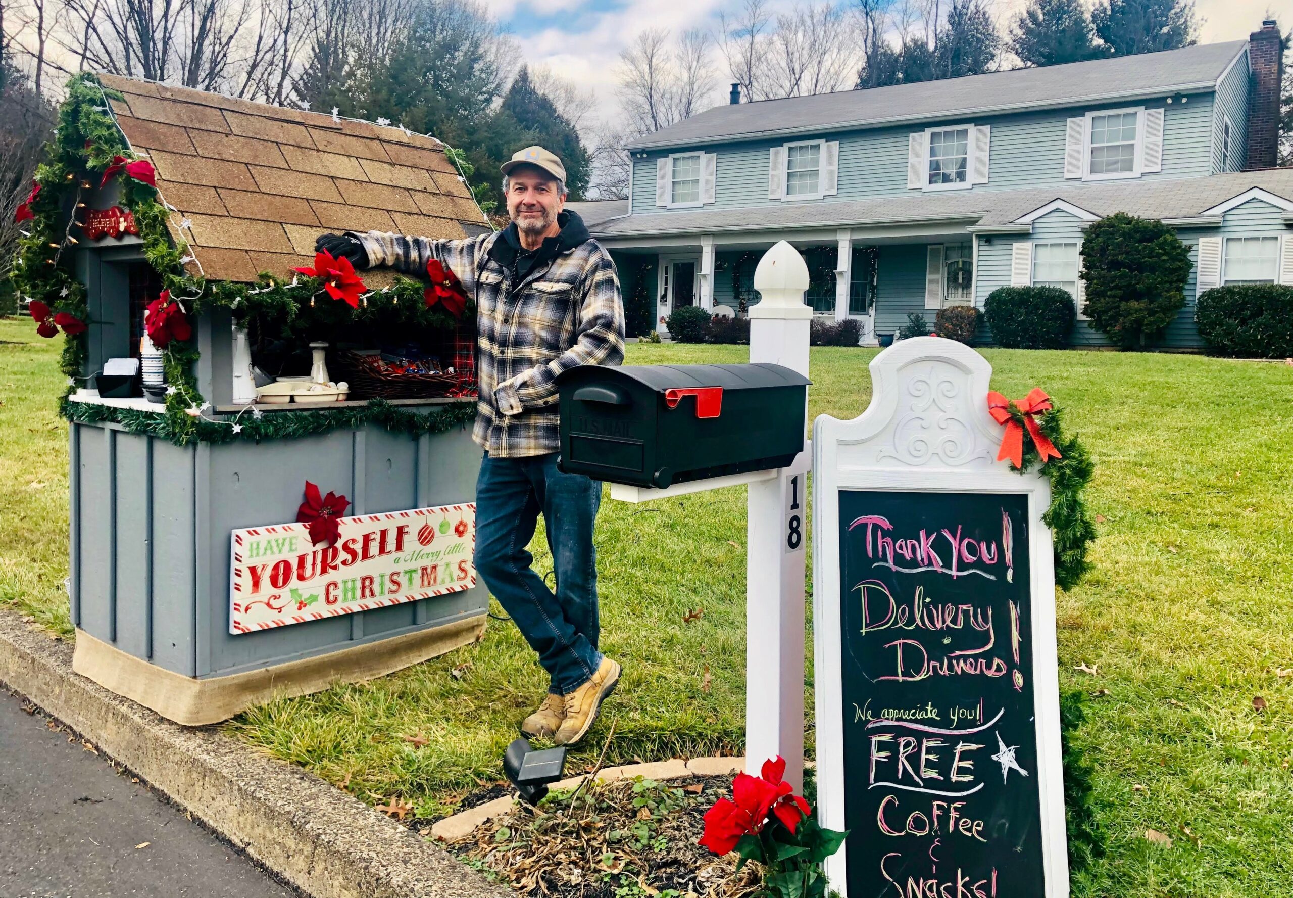 Greg Flego, 65, outside his Doylestown, Pa., home with his new holiday rest station for delivery workers. (Credit: Nadine Flego)