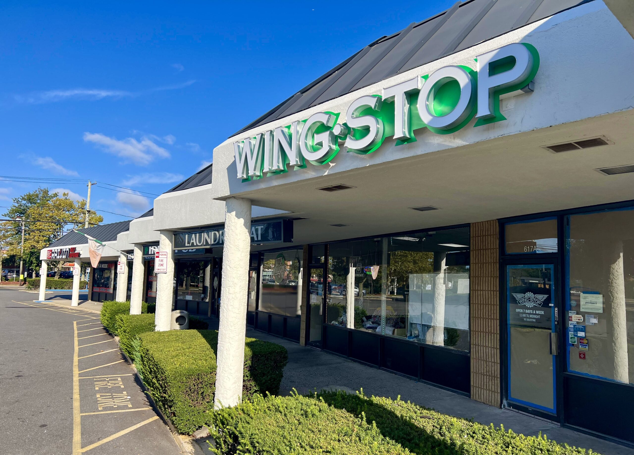 Top: The new Wingstop location at 617 Montauk Highway in Bay Shore. (Credit: Mike White)