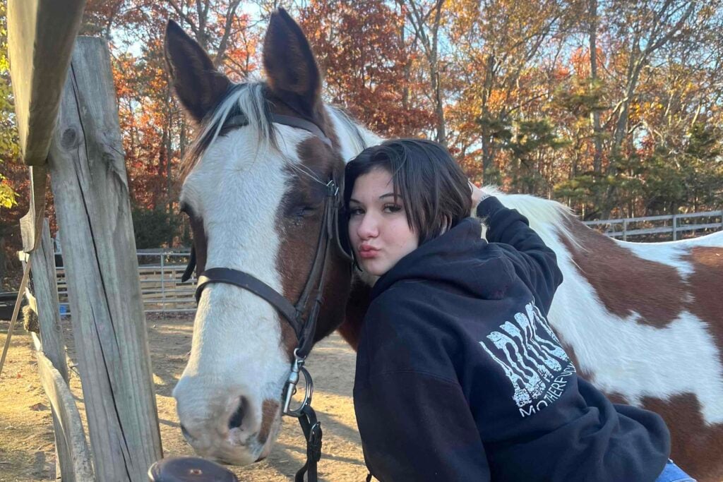 Photo os missing Patchogue teen Emmarae Gervasi with a house on a farm.