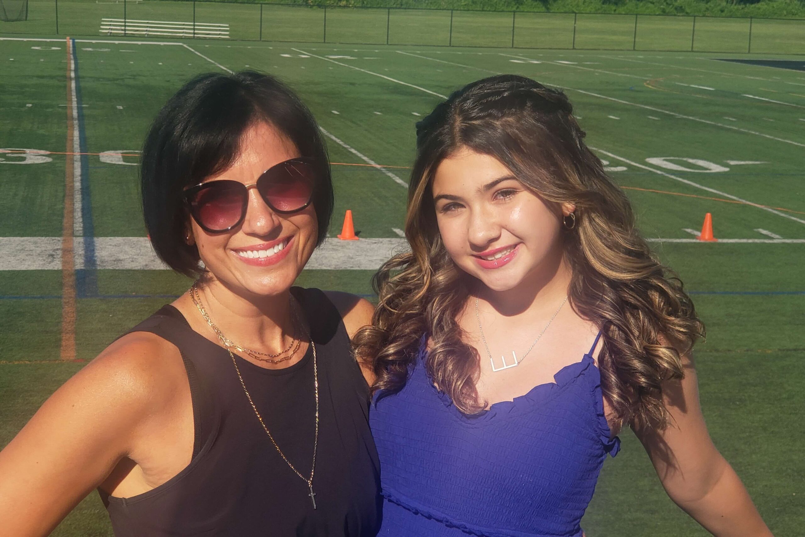 Mother and daughter outside.