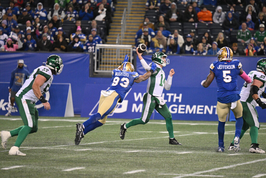 Jack Coan playing for the Roughriders in the CFL (Credit: Arthur Ward/CFL)